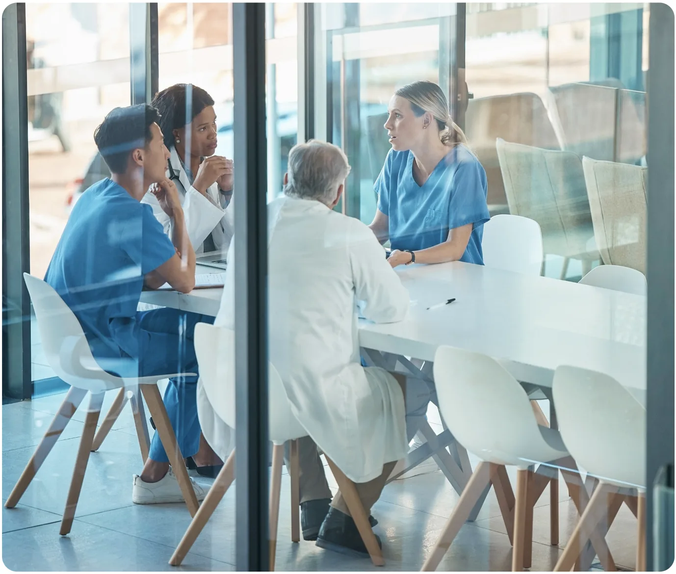 Diverse-Medical-Team-Having-a-Collaborative-Strategy-Meeting-in-a-Hospital-Conference-Room-Image Diverse Medical Team Having a Collaborative Strategy Meeting in a Hospital Conference Room