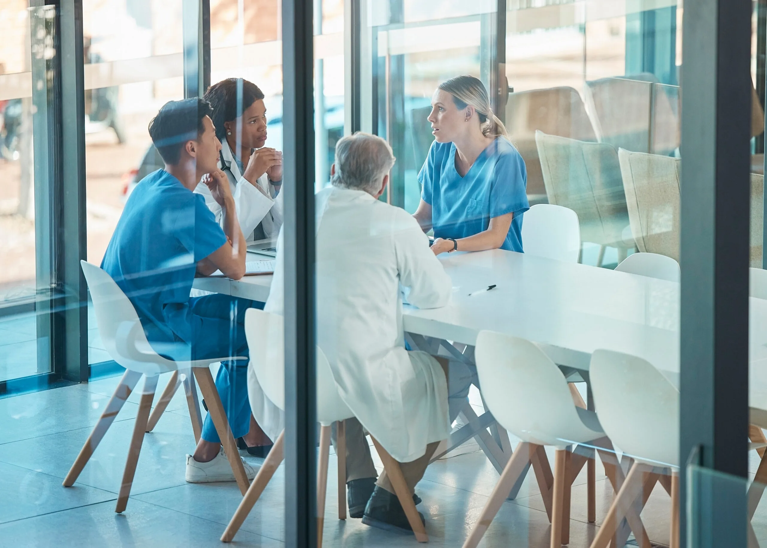 Diverse Medical Team Having a Collaborative Strategy Meeting in a Hospital Conference Room