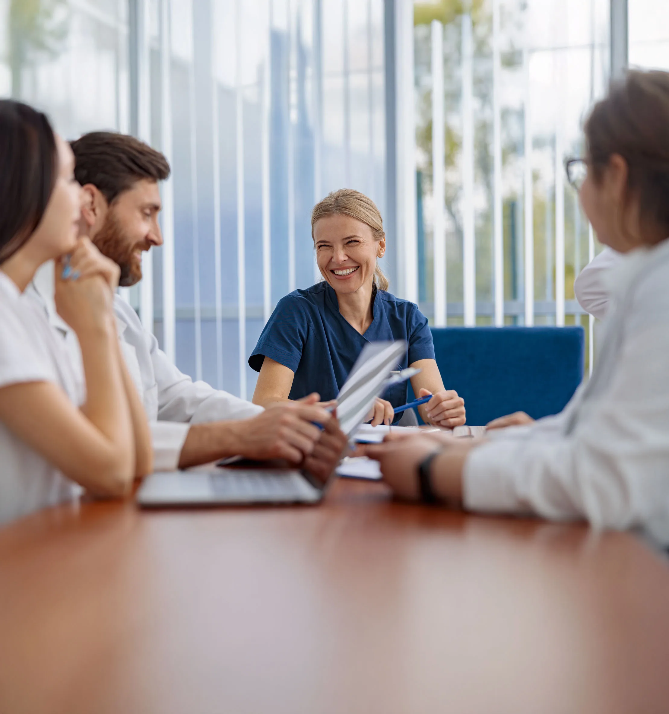 Healthcare Professionals Collaborating in a Bright Office Conference Room